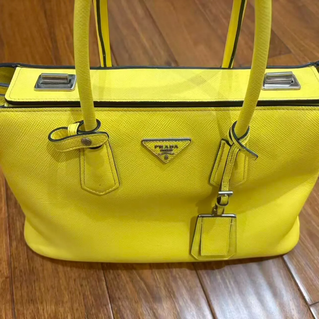 Second-hand bright yellow handbag