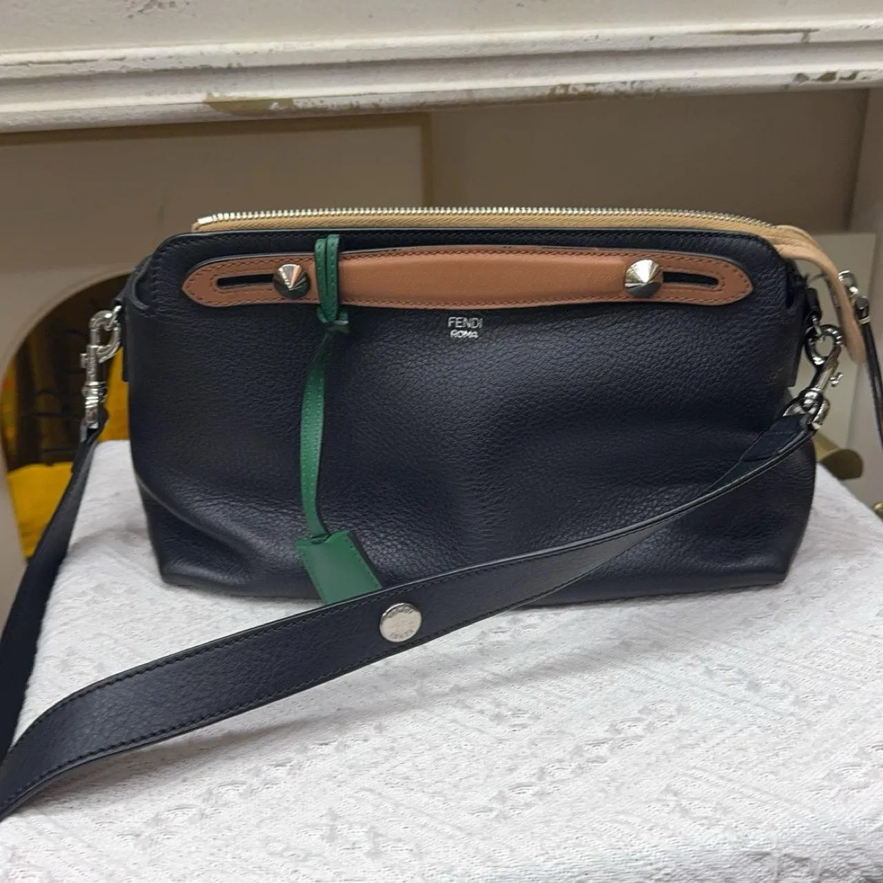 Second-hand black and brown with gray stripes crossbody bag. By the way